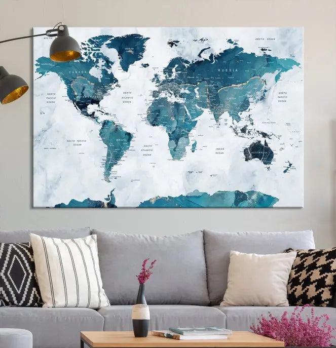 The Turquoise World Map Wall Art Canvas Print elegantly graces a dark wall. Crafted on museum-quality canvas with a UV-protective coating, it promises lasting elegance.