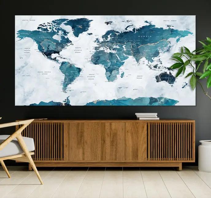 The Turquoise World Map Wall Art Canvas Print elegantly graces a dark wall. Crafted on museum-quality canvas with a UV-protective coating, it promises lasting elegance.