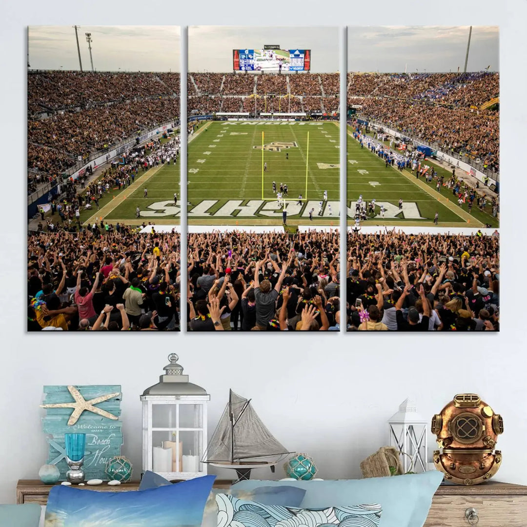 The living room features premium artwork, the "UCF Knights Football Team Print - Orlando FBC Mortgage Stadium Wall Art Canvas Print," a three-panel canvas piece depicting a bustling football stadium. Handmade in the USA, this artwork adds a dynamic and vibrant touch to your space.