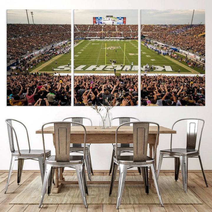 The living room features premium artwork, the "UCF Knights Football Team Print - Orlando FBC Mortgage Stadium Wall Art Canvas Print," a three-panel canvas piece depicting a bustling football stadium. Handmade in the USA, this artwork adds a dynamic and vibrant touch to your space.