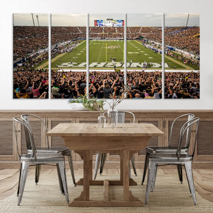 The living room features premium artwork, the "UCF Knights Football Team Print - Orlando FBC Mortgage Stadium Wall Art Canvas Print," a three-panel canvas piece depicting a bustling football stadium. Handmade in the USA, this artwork adds a dynamic and vibrant touch to your space.