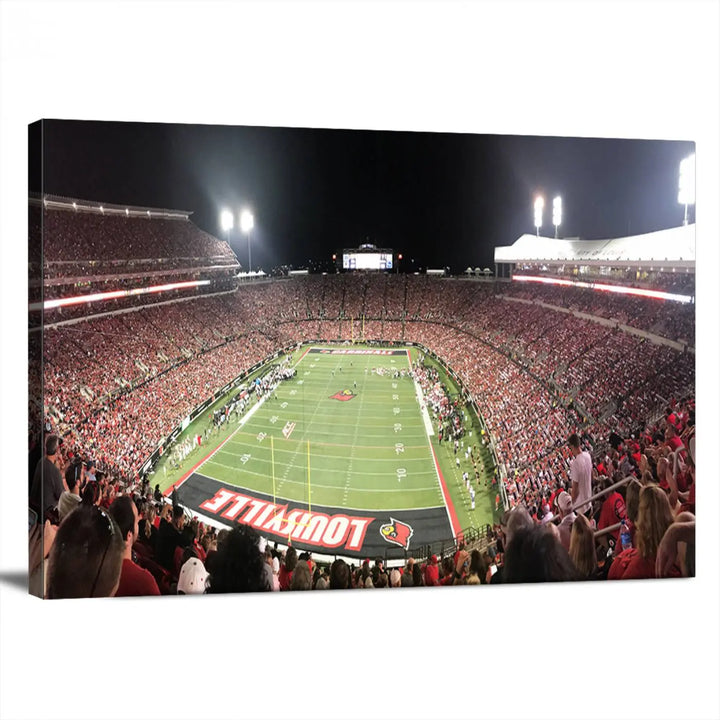 A canvas print featuring the University of Louisville Cardinals Football Team and a bustling Cardinal Stadium at night adorns the wall.