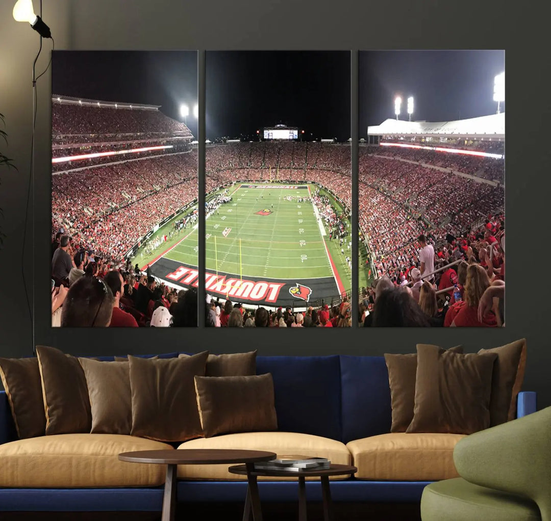 A canvas print featuring the University of Louisville Cardinals Football Team and a bustling Cardinal Stadium at night adorns the wall.