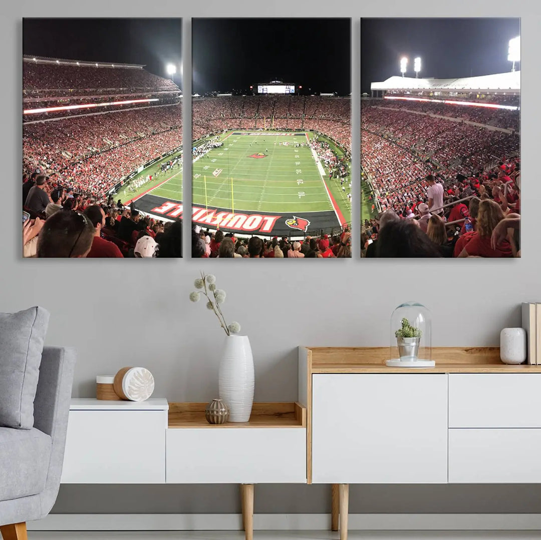 A canvas print featuring the University of Louisville Cardinals Football Team and a bustling Cardinal Stadium at night adorns the wall.