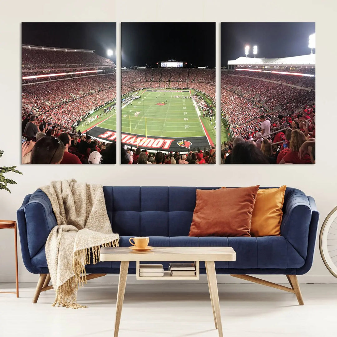 A canvas print featuring the University of Louisville Cardinals Football Team and a bustling Cardinal Stadium at night adorns the wall.