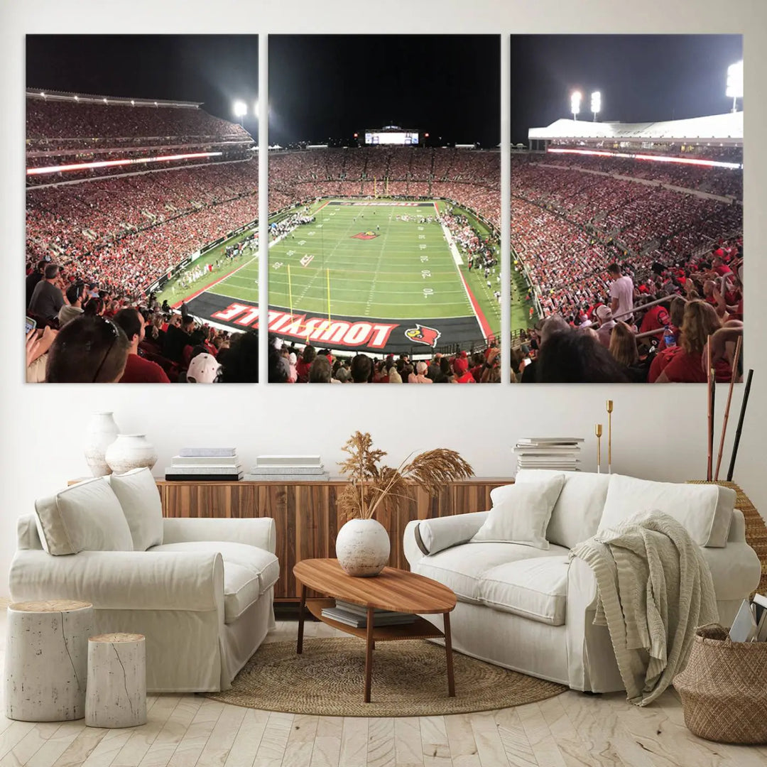 A canvas print featuring the University of Louisville Cardinals Football Team and a bustling Cardinal Stadium at night adorns the wall.