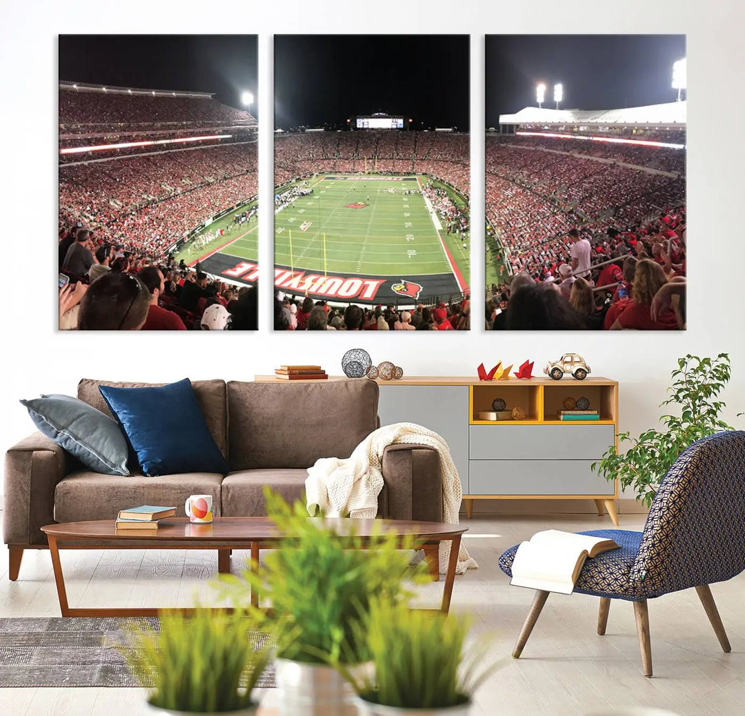 A canvas print featuring the University of Louisville Cardinals Football Team and a bustling Cardinal Stadium at night adorns the wall.