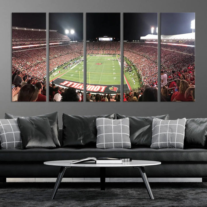 A canvas print featuring the University of Louisville Cardinals Football Team and a bustling Cardinal Stadium at night adorns the wall.