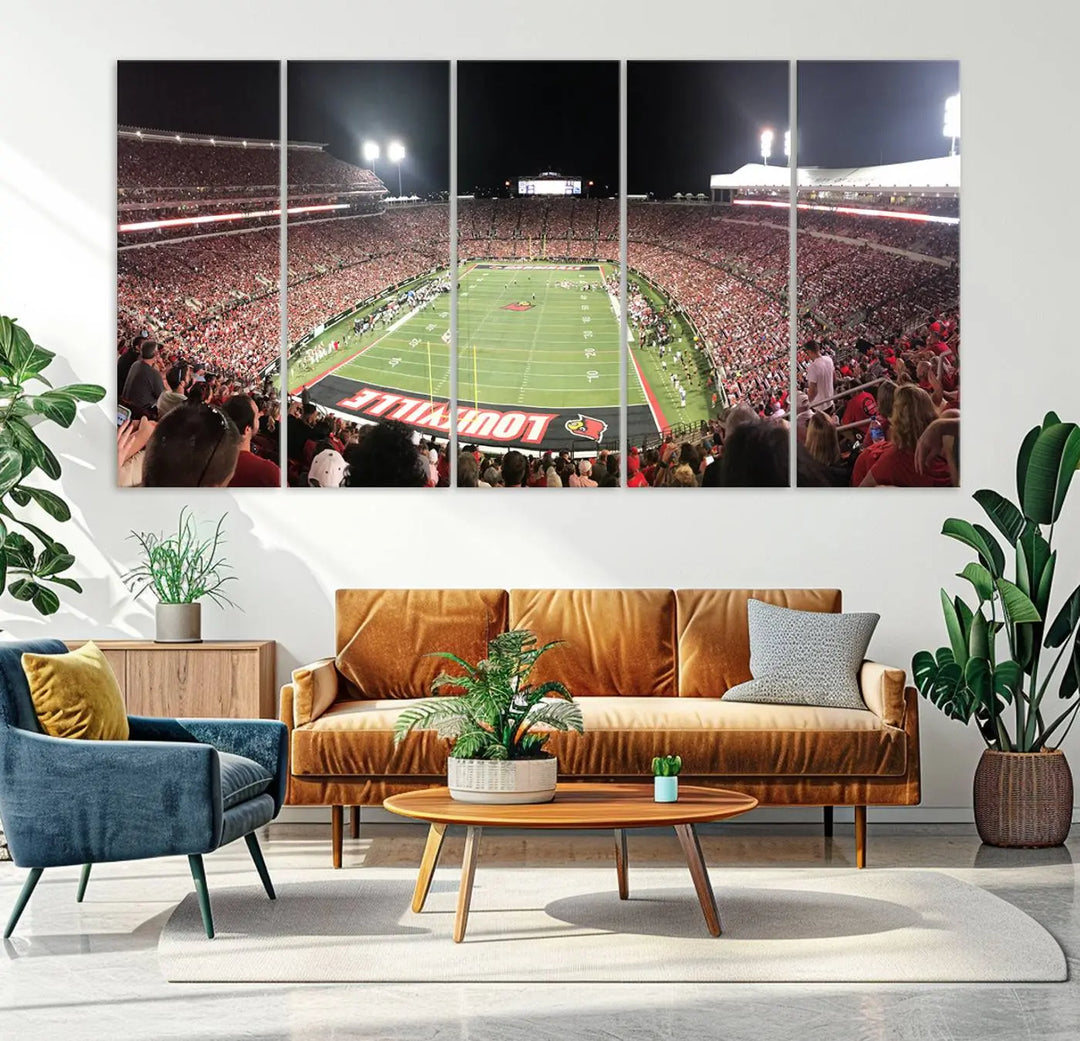 A canvas print featuring the University of Louisville Cardinals Football Team and a bustling Cardinal Stadium at night adorns the wall.