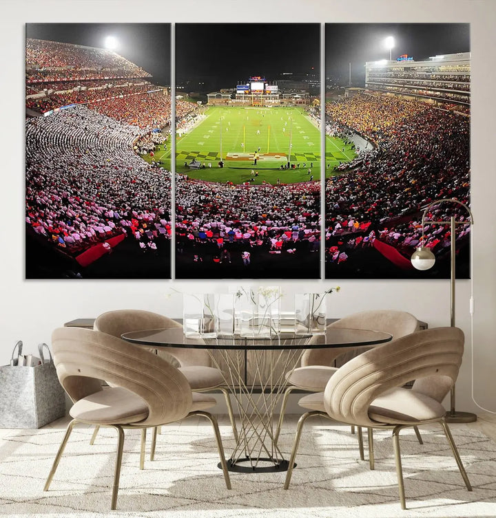 A University of Maryland Terrapins Football Team Print, featuring the College Park SECU Stadium at night, printed on premium canvas with a gallery-quality finish, enhances a modern living room.