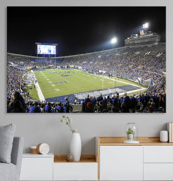 A triptych featuring the University of Memphis Tigers football team at the bustling Simmons Bank Liberty Stadium during a night game is artistically crafted as canvas wall art with a gallery-quality finish. Handmade in the USA, it encapsulates the vibrant energy of sports under dazzling night lights.