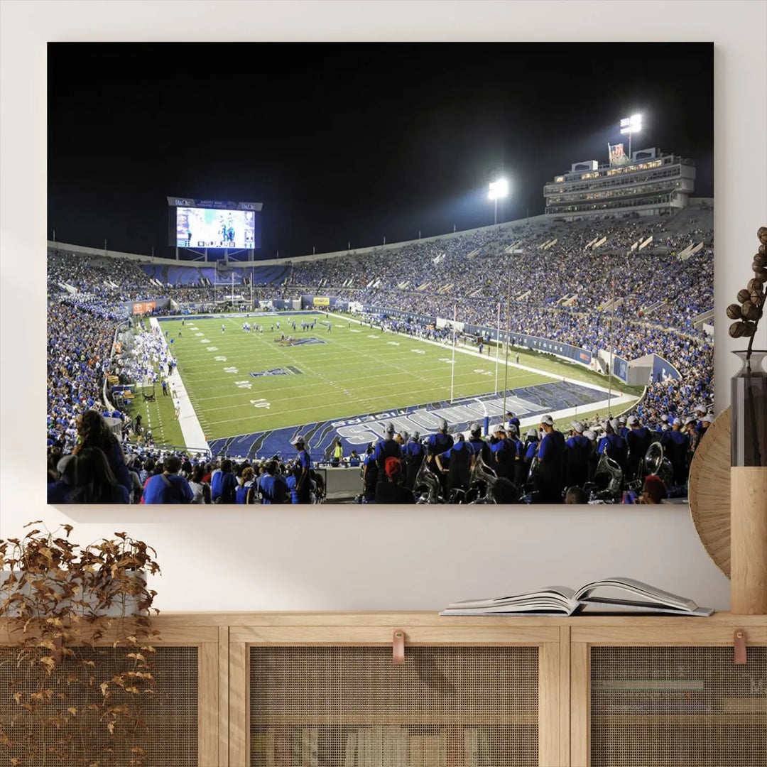 A triptych featuring the University of Memphis Tigers football team at the bustling Simmons Bank Liberty Stadium during a night game is artistically crafted as canvas wall art with a gallery-quality finish. Handmade in the USA, it encapsulates the vibrant energy of sports under dazzling night lights.