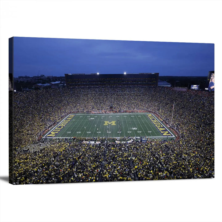 Experience the excitement and grandeur of a packed football stadium at night with this University of Michigan Wolverines Football Team Print. Featuring a panoramic view of the iconic Ann Arbor Michigan Stadium and its green field adorned with a large M logo, this canvas artwork offers a gallery-quality finish that brings an energetic moment into your space.