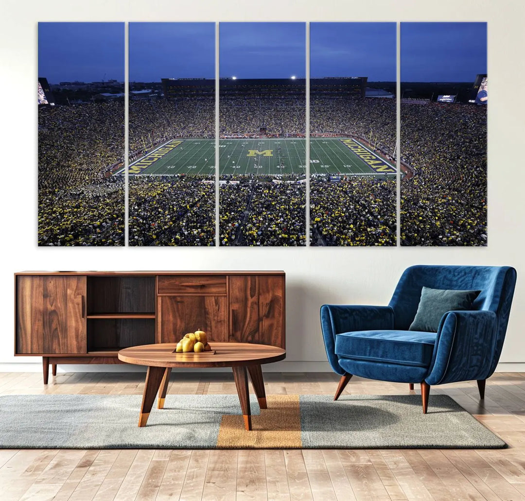 Experience the excitement and grandeur of a packed football stadium at night with this University of Michigan Wolverines Football Team Print. Featuring a panoramic view of the iconic Ann Arbor Michigan Stadium and its green field adorned with a large M logo, this canvas artwork offers a gallery-quality finish that brings an energetic moment into your space.