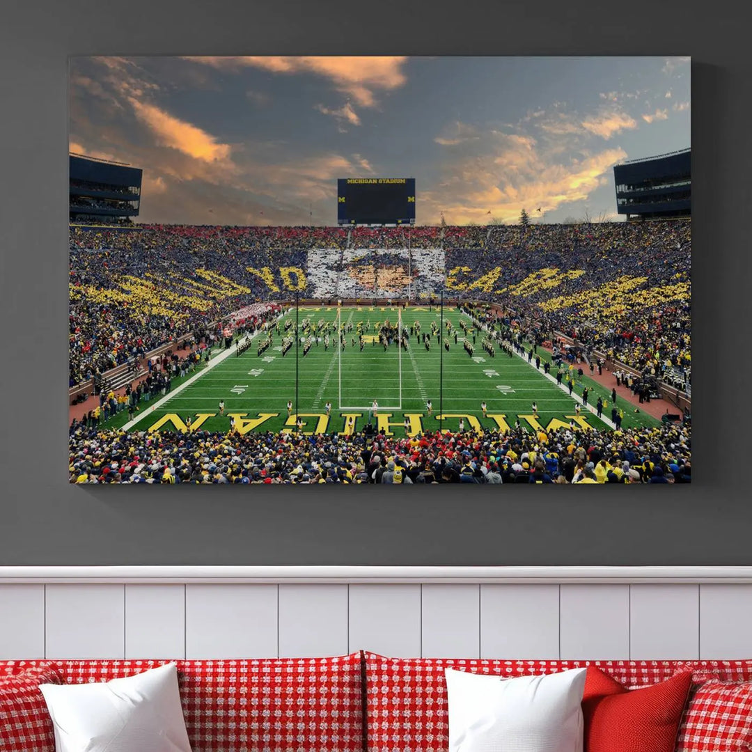 A living room showcases the University of Michigan Wolverines Football Team Print - Ann Arbor Michigan Stadium Wall Art Canvas Print in a triptych style. This stunning piece features a gallery-quality finish on premium canvas, infusing elegance into the space.