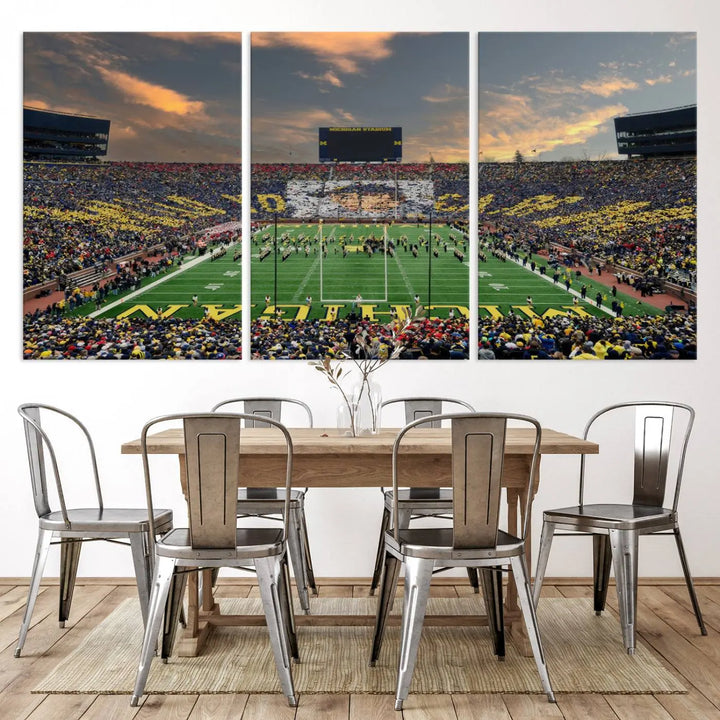 A living room showcases the University of Michigan Wolverines Football Team Print - Ann Arbor Michigan Stadium Wall Art Canvas Print in a triptych style. This stunning piece features a gallery-quality finish on premium canvas, infusing elegance into the space.