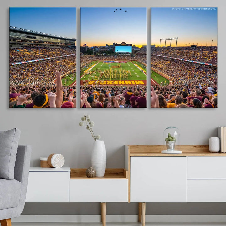 The University of Minnesota Golden Gophers Football Team Print captures the excitement of Minneapolis' Huntington Bank Stadium. This vibrant three-panel wall art showcases an enthusiastic crowd and a clear view of the field. Crafted on premium canvas with a gallery-quality finish, it transforms any space into an exhilarating sports sanctuary.