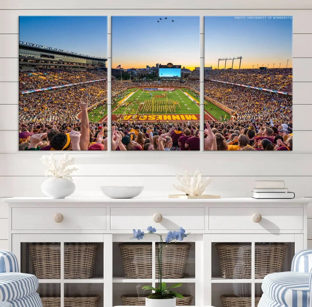 The University of Minnesota Golden Gophers Football Team Print captures the excitement of Minneapolis' Huntington Bank Stadium. This vibrant three-panel wall art showcases an enthusiastic crowd and a clear view of the field. Crafted on premium canvas with a gallery-quality finish, it transforms any space into an exhilarating sports sanctuary.