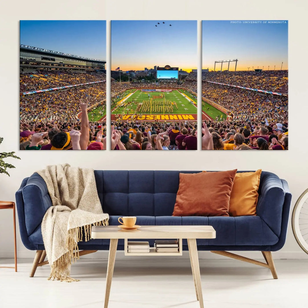 The University of Minnesota Golden Gophers Football Team Print captures the excitement of Minneapolis' Huntington Bank Stadium. This vibrant three-panel wall art showcases an enthusiastic crowd and a clear view of the field. Crafted on premium canvas with a gallery-quality finish, it transforms any space into an exhilarating sports sanctuary.