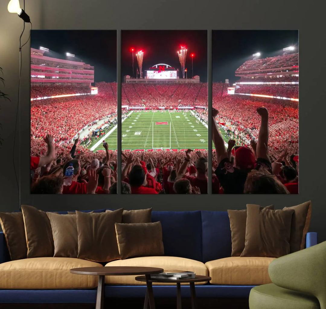 The University of Nebraska Cornhuskers Football Team Print, a vibrant three-panel canvas depicting Lincoln Memorial Stadium filled with enthusiastic fans from the end zone perspective, features a gallery-quality finish.