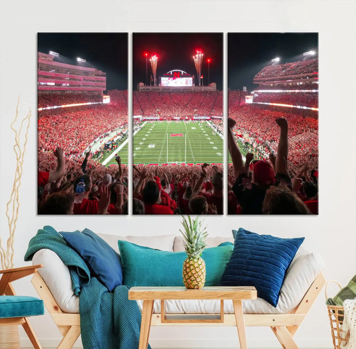 The University of Nebraska Cornhuskers Football Team Print, a vibrant three-panel canvas depicting Lincoln Memorial Stadium filled with enthusiastic fans from the end zone perspective, features a gallery-quality finish.