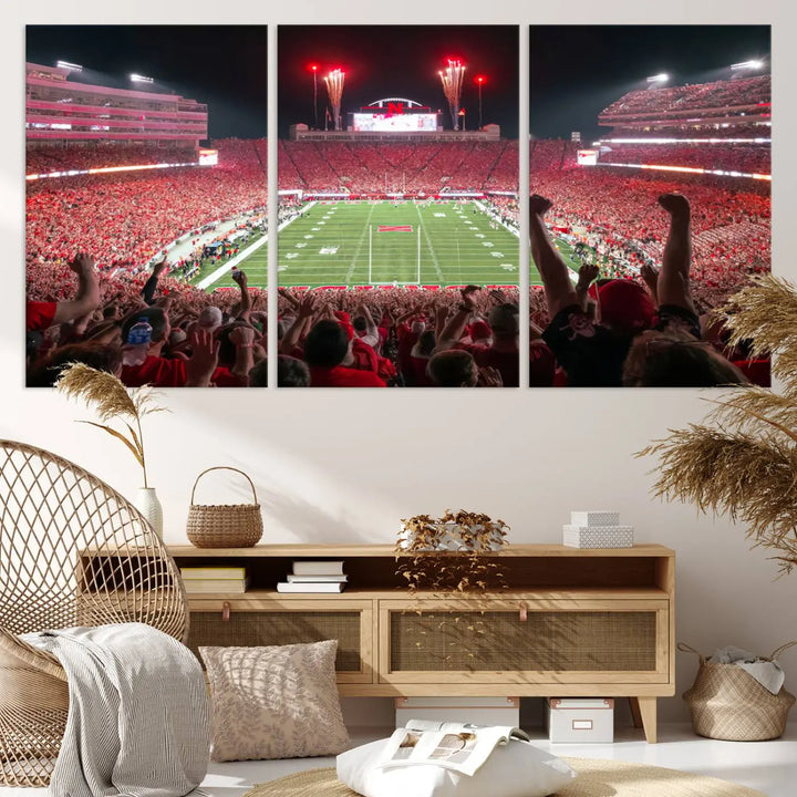 The University of Nebraska Cornhuskers Football Team Print, a vibrant three-panel canvas depicting Lincoln Memorial Stadium filled with enthusiastic fans from the end zone perspective, features a gallery-quality finish.