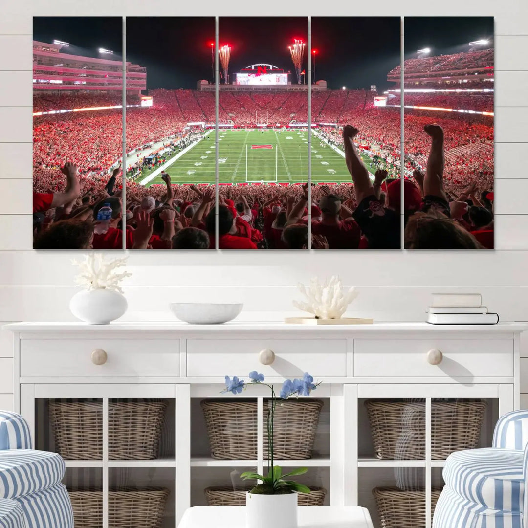 The University of Nebraska Cornhuskers Football Team Print, a vibrant three-panel canvas depicting Lincoln Memorial Stadium filled with enthusiastic fans from the end zone perspective, features a gallery-quality finish.