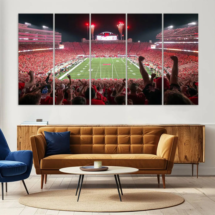 The University of Nebraska Cornhuskers Football Team Print, a vibrant three-panel canvas depicting Lincoln Memorial Stadium filled with enthusiastic fans from the end zone perspective, features a gallery-quality finish.