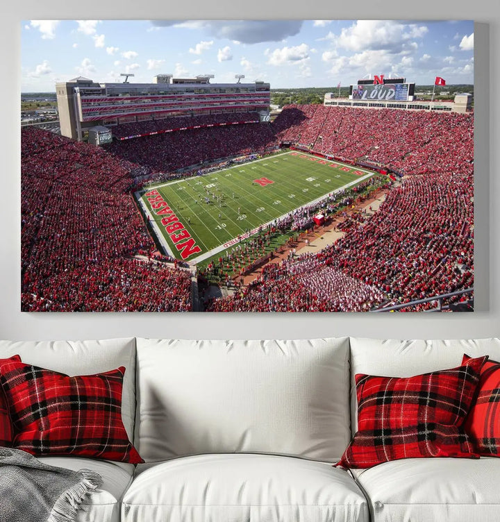 The University of Nebraska Cornhuskers Football Team Print showcases a vibrant triptych of Lincoln Memorial Stadium, depicting a packed football stadium filled with energetic fans. This handmade art piece is crafted in the USA and printed on premium canvas for a gallery-quality finish.