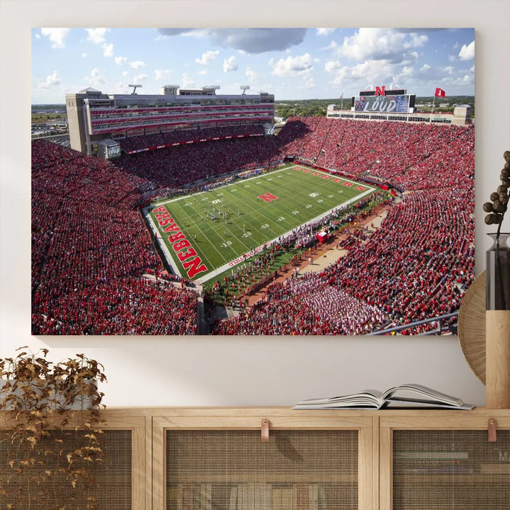 The University of Nebraska Cornhuskers Football Team Print showcases a vibrant triptych of Lincoln Memorial Stadium, depicting a packed football stadium filled with energetic fans. This handmade art piece is crafted in the USA and printed on premium canvas for a gallery-quality finish.