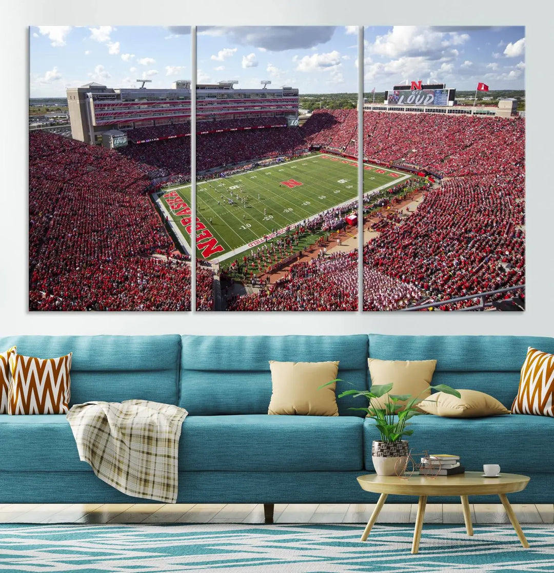 The University of Nebraska Cornhuskers Football Team Print showcases a vibrant triptych of Lincoln Memorial Stadium, depicting a packed football stadium filled with energetic fans. This handmade art piece is crafted in the USA and printed on premium canvas for a gallery-quality finish.