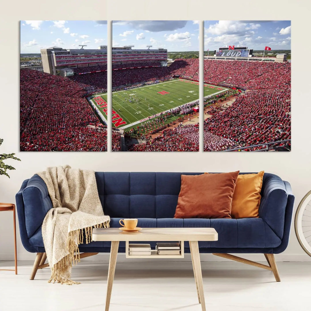 The University of Nebraska Cornhuskers Football Team Print showcases a vibrant triptych of Lincoln Memorial Stadium, depicting a packed football stadium filled with energetic fans. This handmade art piece is crafted in the USA and printed on premium canvas for a gallery-quality finish.