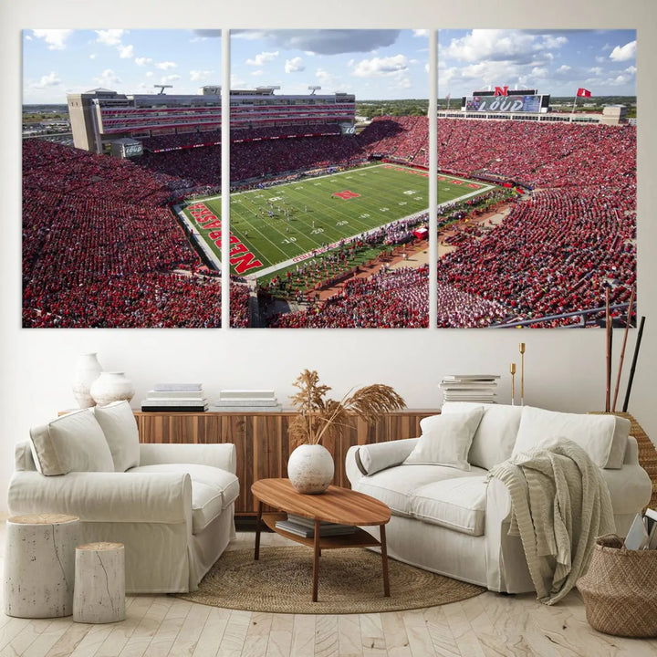 The University of Nebraska Cornhuskers Football Team Print showcases a vibrant triptych of Lincoln Memorial Stadium, depicting a packed football stadium filled with energetic fans. This handmade art piece is crafted in the USA and printed on premium canvas for a gallery-quality finish.