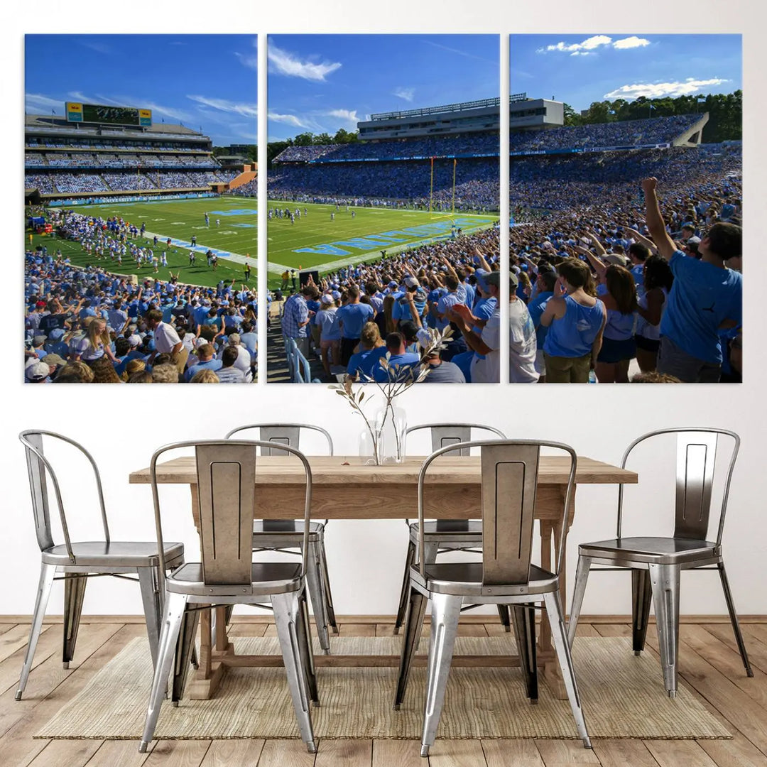 A gallery-quality canvas wall art print featuring the University of North Carolina Tar Heels Football Team and Chapel Hill's Kenan Memorial Stadium adorns the cafe wall.