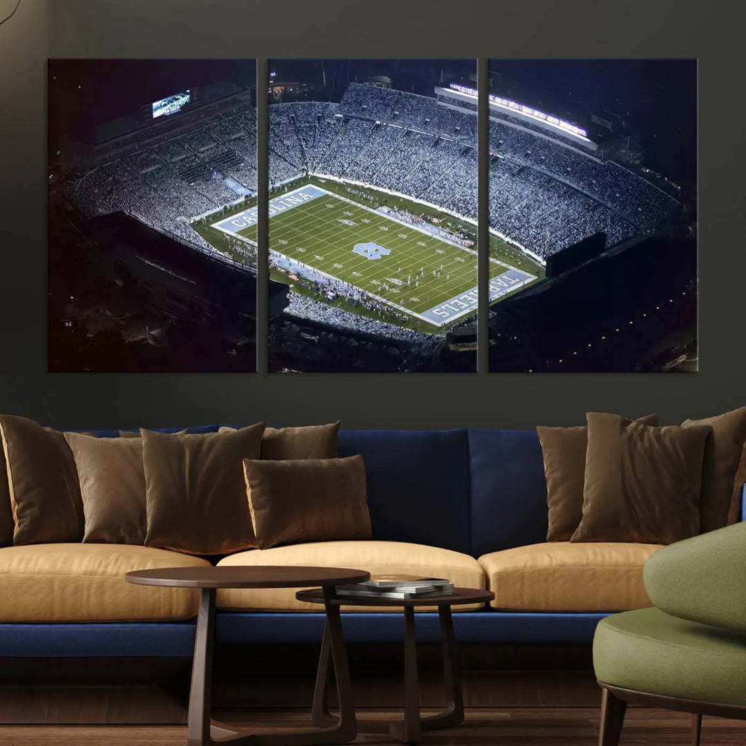 A University of North Carolina Tar Heels Football Team Print, showcasing Chapel Hill's Kenan Memorial Stadium, hangs in a modern dining room, adding a gallery-quality finish that enhances the entire space.