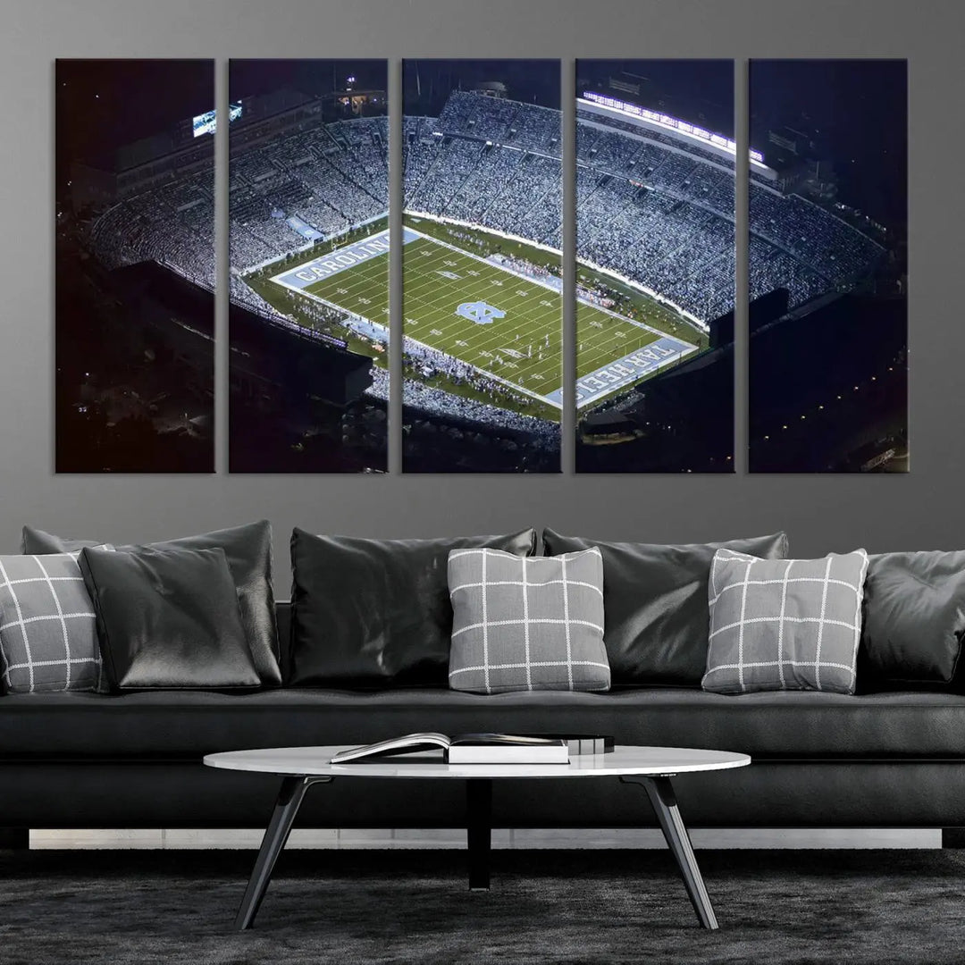 A University of North Carolina Tar Heels Football Team Print, showcasing Chapel Hill's Kenan Memorial Stadium, hangs in a modern dining room, adding a gallery-quality finish that enhances the entire space.