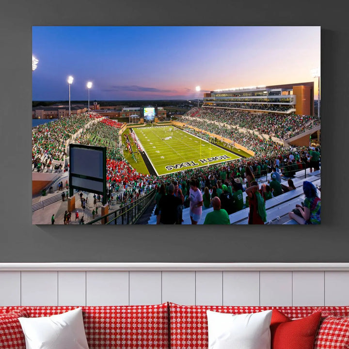 A panoramic triptych of the University of North Texas Mean Green Football Team in a packed Denton DATCU Stadium under evening lights, mounted as premium canvas wall art.