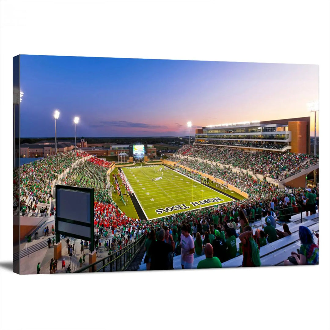 A panoramic triptych of the University of North Texas Mean Green Football Team in a packed Denton DATCU Stadium under evening lights, mounted as premium canvas wall art.