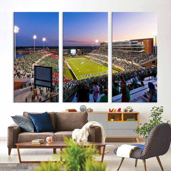 A panoramic triptych of the University of North Texas Mean Green Football Team in a packed Denton DATCU Stadium under evening lights, mounted as premium canvas wall art.