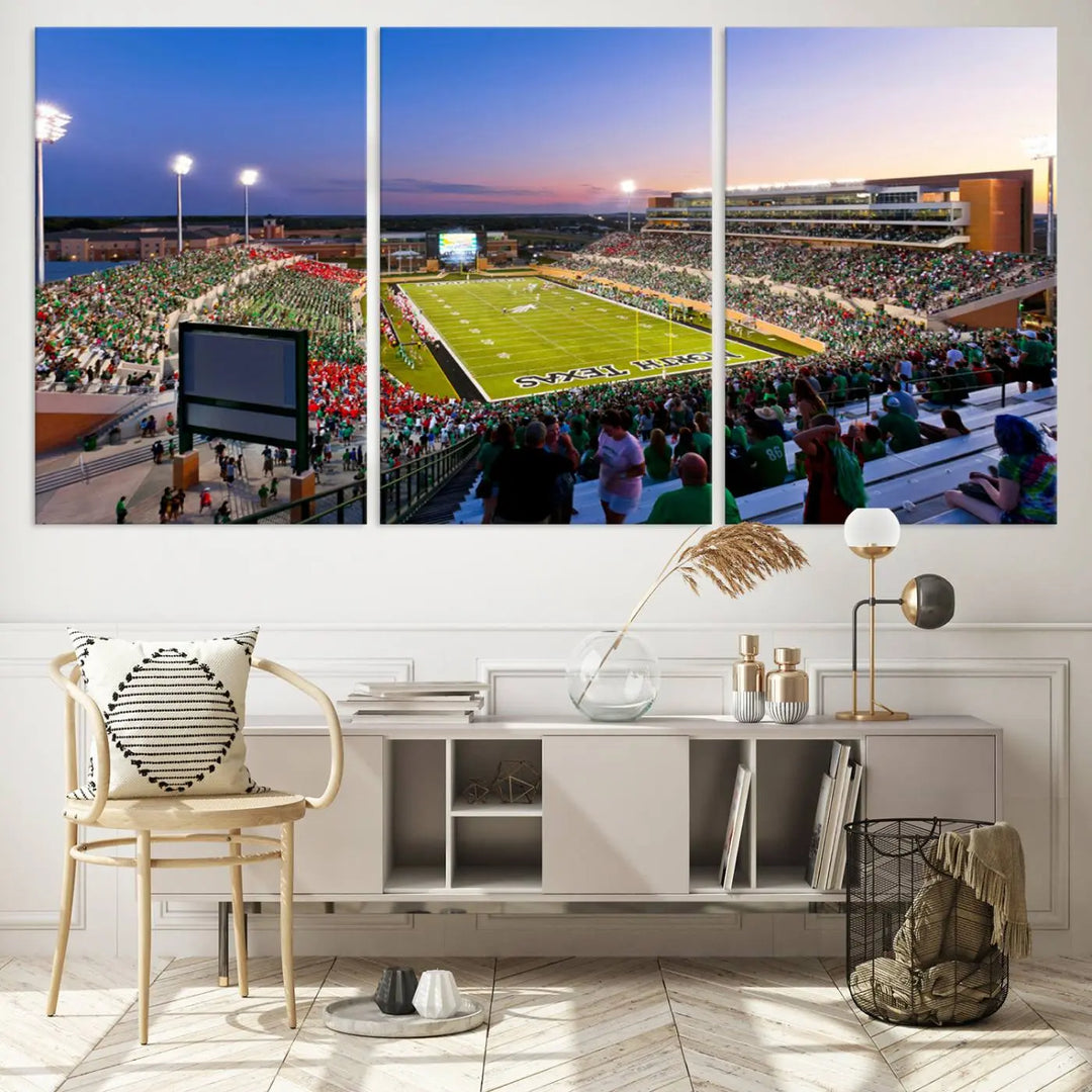 A panoramic triptych of the University of North Texas Mean Green Football Team in a packed Denton DATCU Stadium under evening lights, mounted as premium canvas wall art.