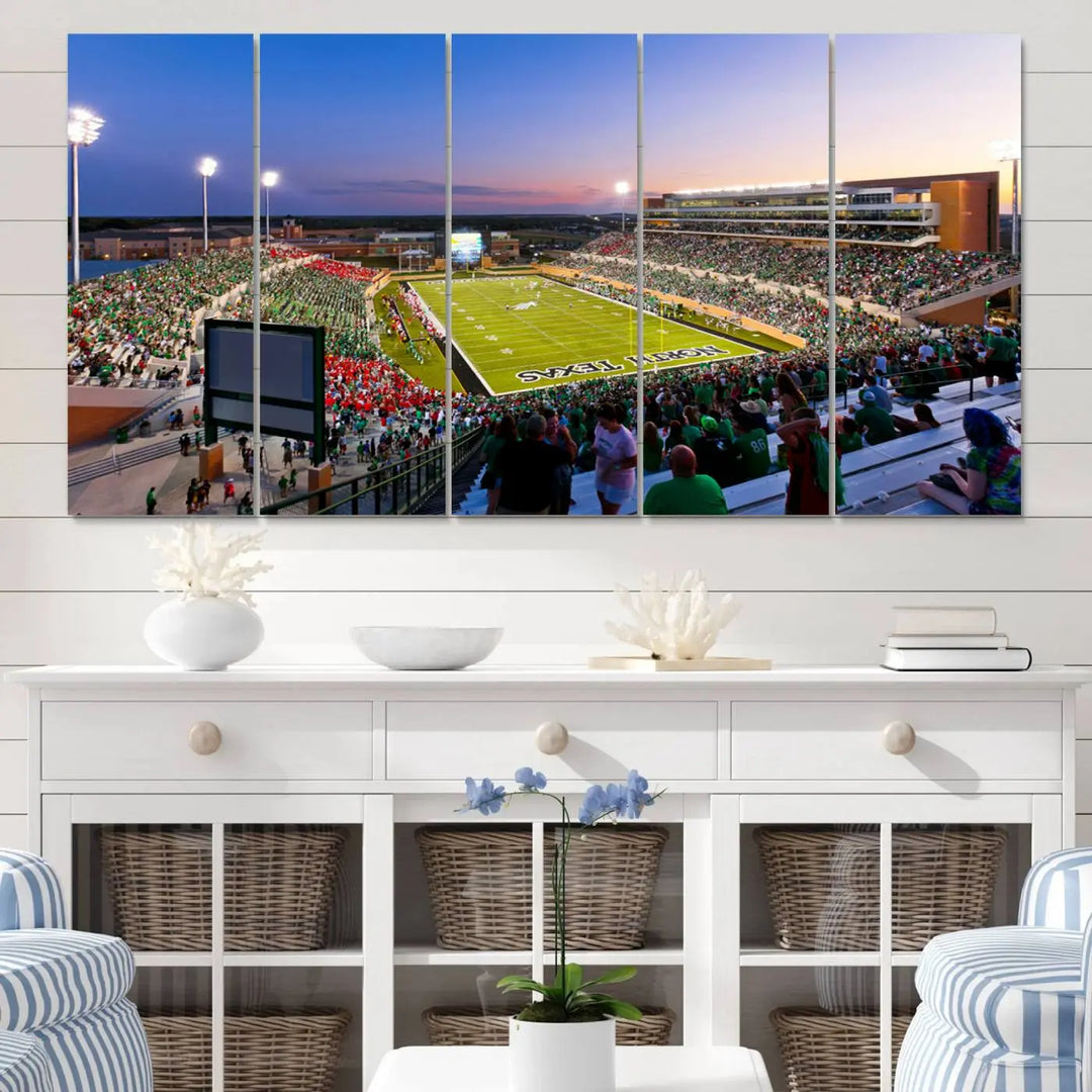 A panoramic triptych of the University of North Texas Mean Green Football Team in a packed Denton DATCU Stadium under evening lights, mounted as premium canvas wall art.