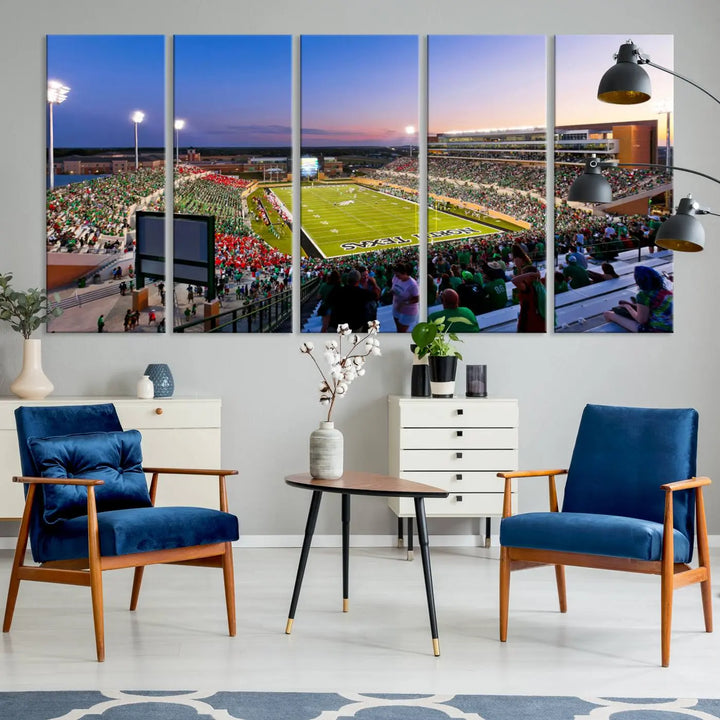 A panoramic triptych of the University of North Texas Mean Green Football Team in a packed Denton DATCU Stadium under evening lights, mounted as premium canvas wall art.