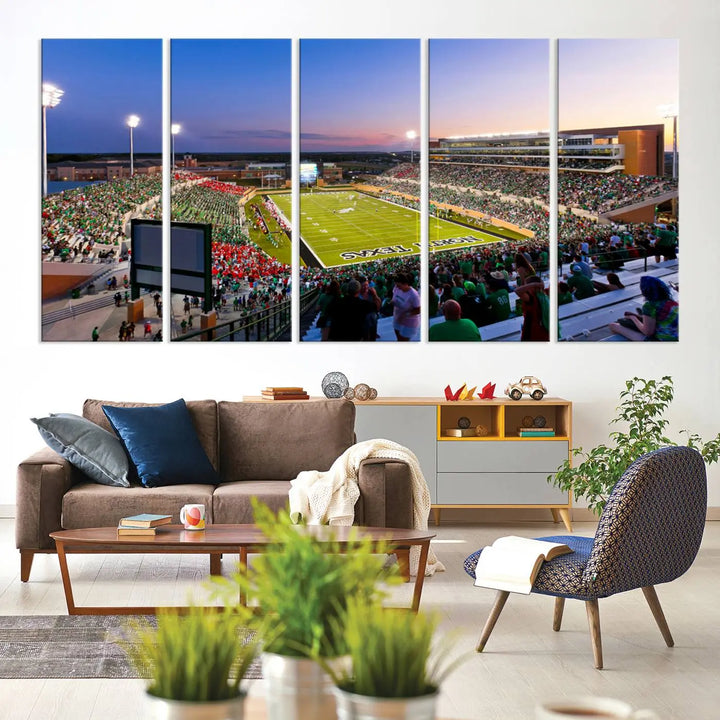 A panoramic triptych of the University of North Texas Mean Green Football Team in a packed Denton DATCU Stadium under evening lights, mounted as premium canvas wall art.