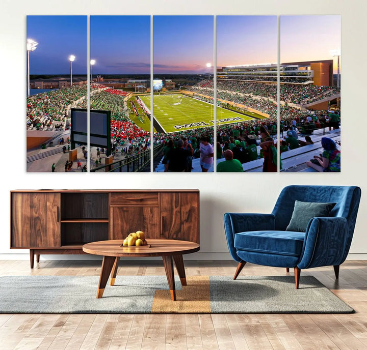 A panoramic triptych of the University of North Texas Mean Green Football Team in a packed Denton DATCU Stadium under evening lights, mounted as premium canvas wall art.