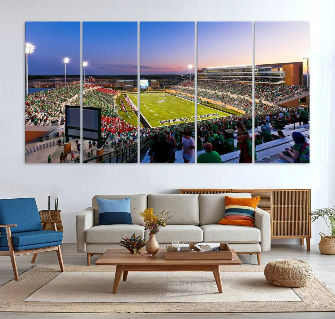 A panoramic triptych of the University of North Texas Mean Green Football Team in a packed Denton DATCU Stadium under evening lights, mounted as premium canvas wall art.