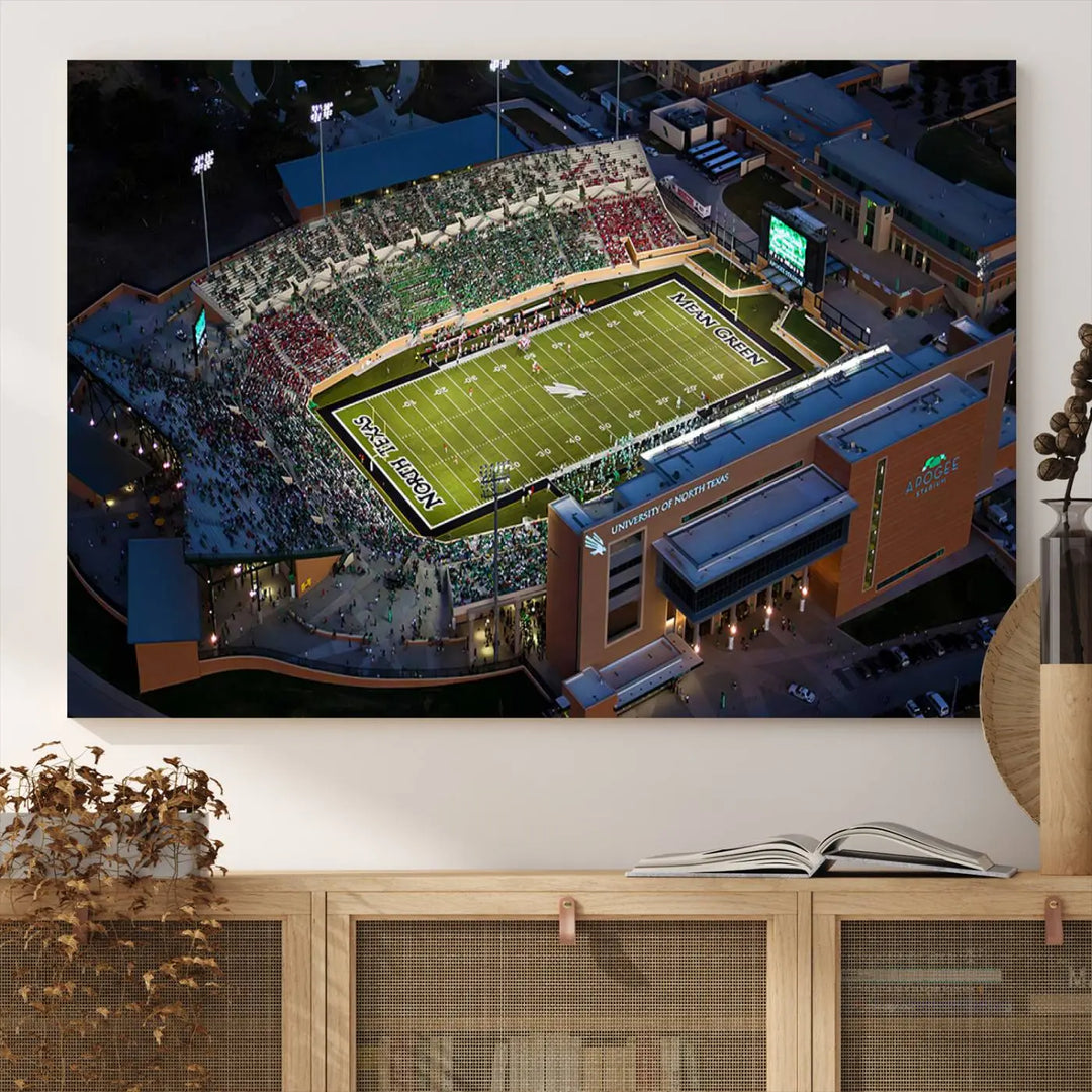 Aerial view of the University of North Texas Mean Green Football Team's DATCU Stadium at night, with packed stands, displayed on a premium canvas print as wall art.