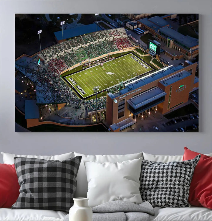 Aerial view of the University of North Texas Mean Green Football Team's DATCU Stadium at night, with packed stands, displayed on a premium canvas print as wall art.