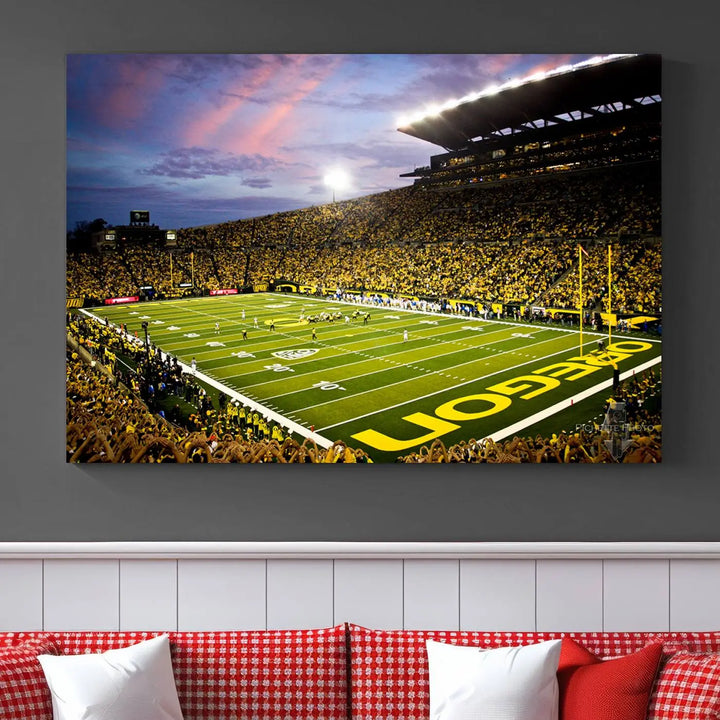 The living room showcases a triptych titled "University of Oregon Ducks Football Team Print - Eugene Autzen Stadium Wall Art Canvas Print," exhibiting a football stadium at sunset with a premium gallery-quality finish.