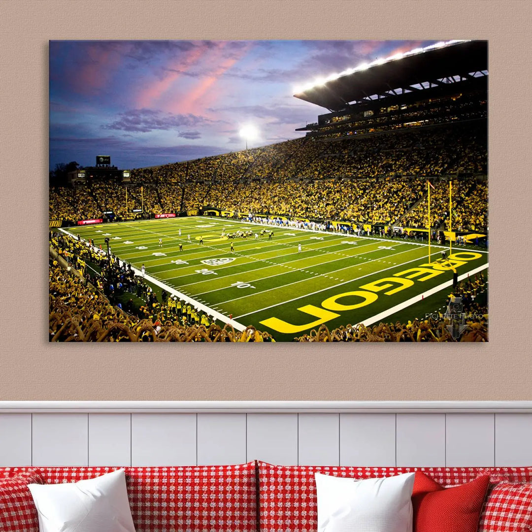 The living room showcases a triptych titled "University of Oregon Ducks Football Team Print - Eugene Autzen Stadium Wall Art Canvas Print," exhibiting a football stadium at sunset with a premium gallery-quality finish.