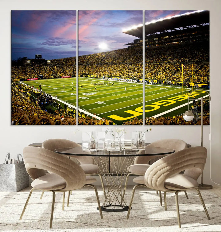 The living room showcases a triptych titled "University of Oregon Ducks Football Team Print - Eugene Autzen Stadium Wall Art Canvas Print," exhibiting a football stadium at sunset with a premium gallery-quality finish.